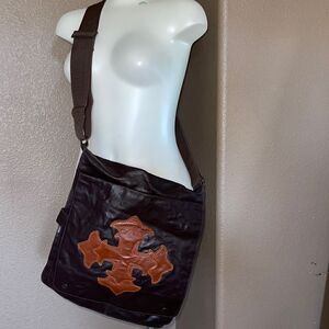 Brown leather crossbody messenger bag with orange cross